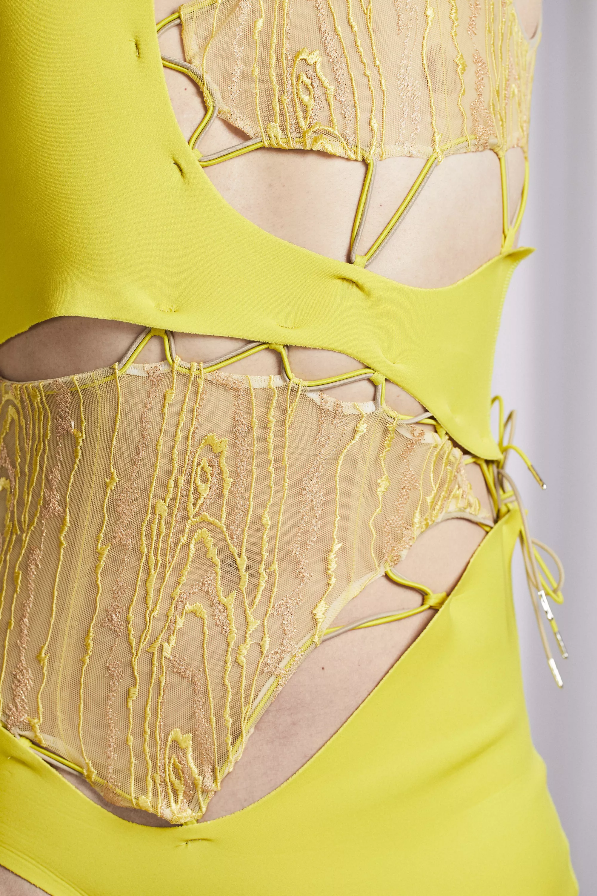 <p>A white skinned person wears the design, showing the embroidery. </p>
